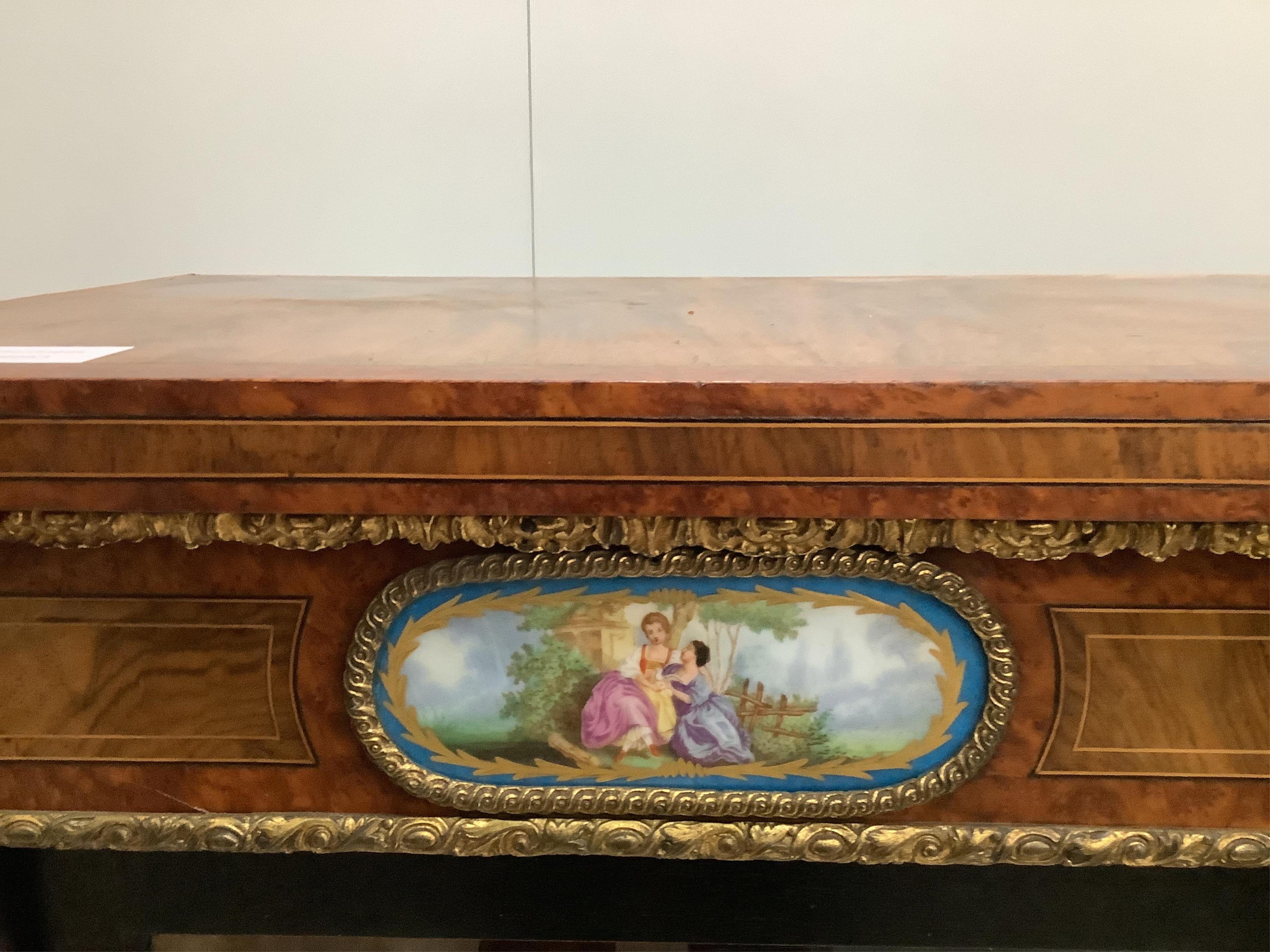 A Victorian amboyna banded figured walnut credenza, width 188cm, depth 44cm, height 109cm. Condition - fair to good